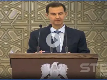 بالفيديو|| شاهد الوعكة الصحية التي تعرض لها بشار الأسد أثناء خطابه وكيف برر ذلك - وكالة ستيب نيوز