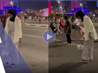 شاهد|| فتاة محجبة بأحد شوارع قطر تخطف الأضواء وتلقن شاباً درساً بفنون كرة القدم - وكالة ستيب نيوز
